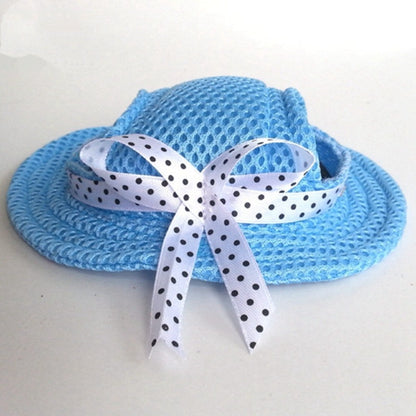 Ozzie breathable mesh bow dog hat in light gray worn by a small dog outdoors