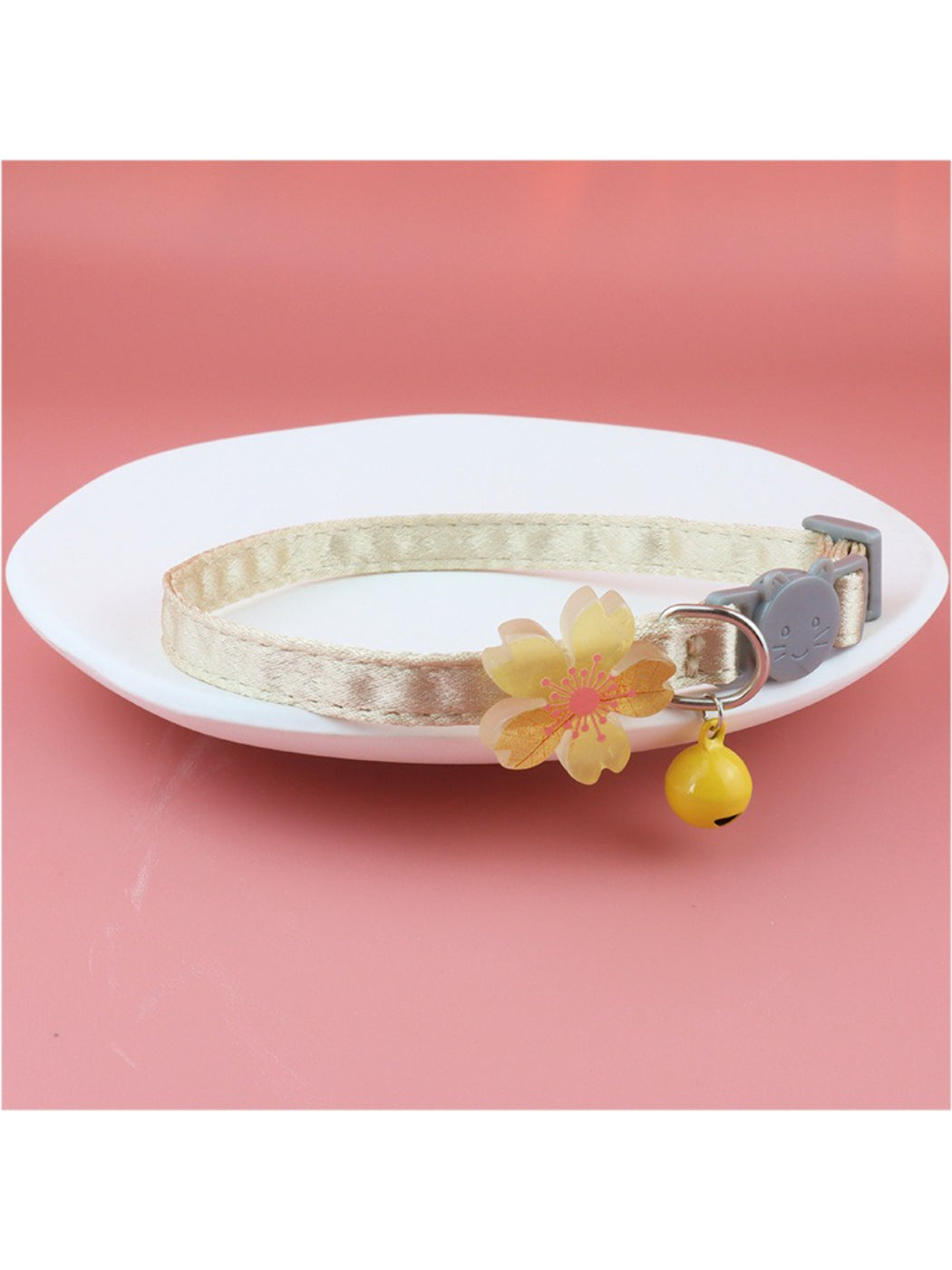 Pastel flower bell cat collar wrapped around a cat's neck
