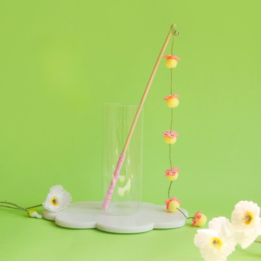 Moo Hanging Pom Wand interactive cat toy with pom poms arranged on a stick