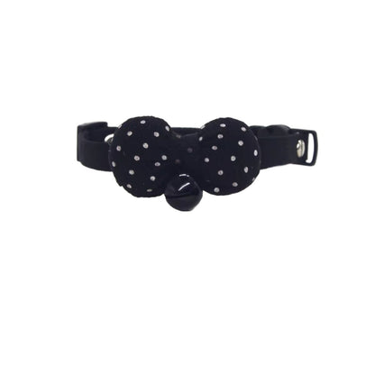 Side view of Mokka breakaway cat collar featuring white polka dot bow on brown strap