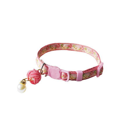 Mokka Pearl Flower Cat Collar featuring pearl flower detail on a dark background