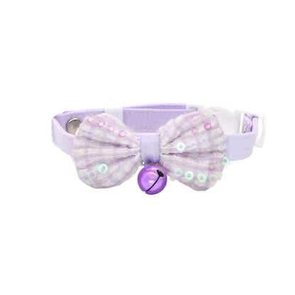 Pastel pink bow bell cat collar packaged in clear plastic