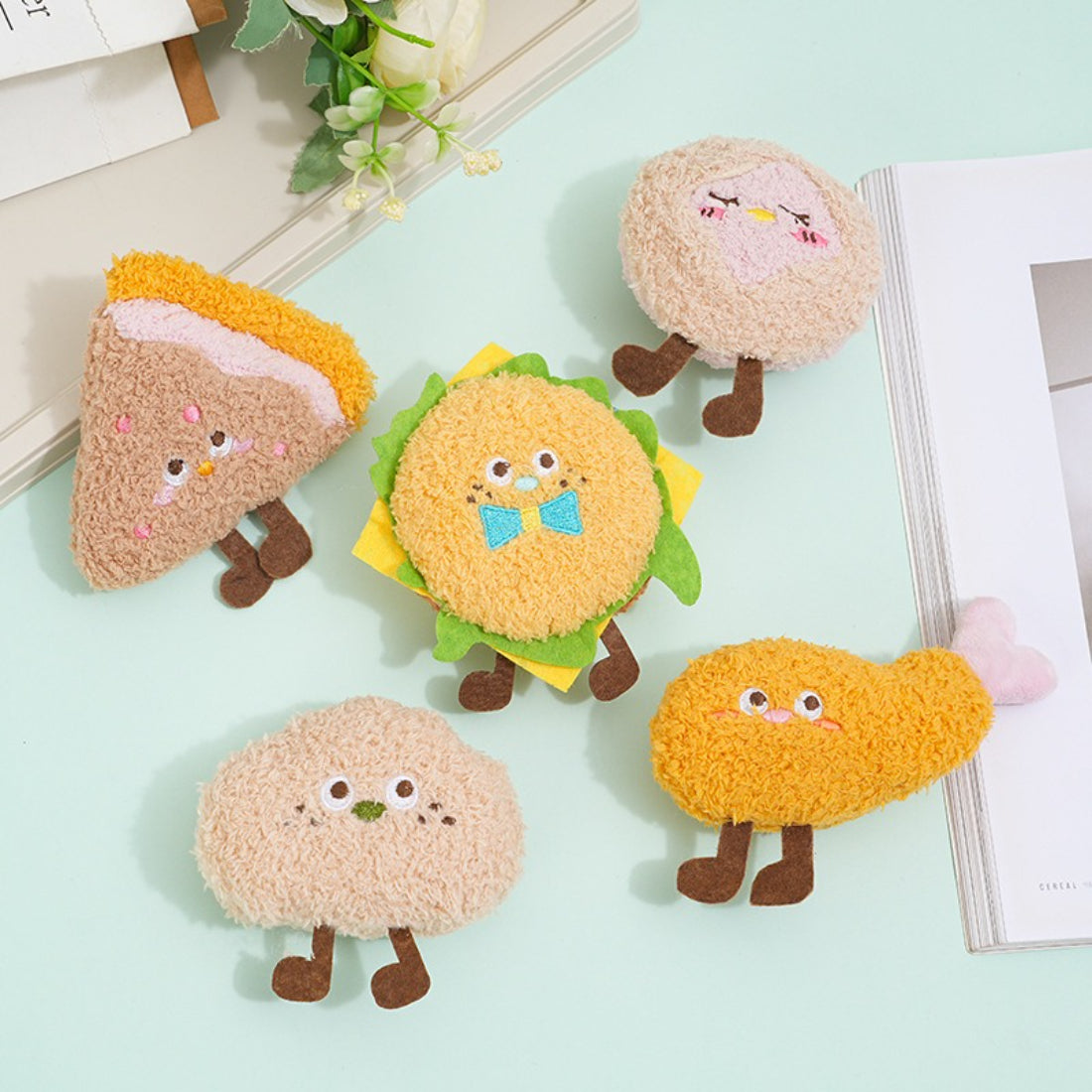 Moo food plush cat toy shaped like a hamburger with colorful fabric layers