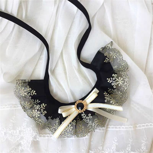 Close-up of Mokka black ruffle cat collar showing texture and buckle detail