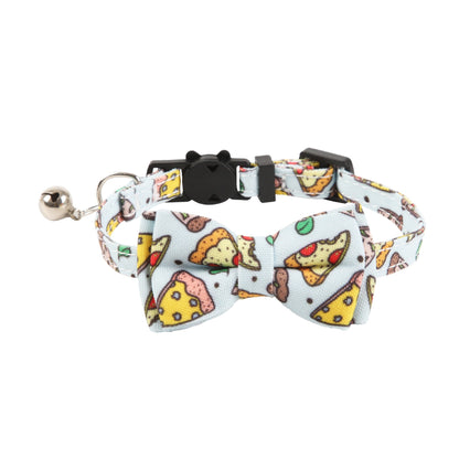 Mokka cat collar with food print and bell displayed on a wooden surface