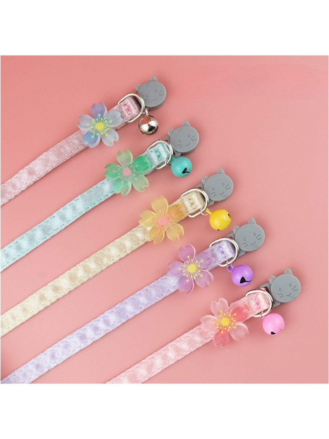 Pastel flower bell cat collar displayed on a white background