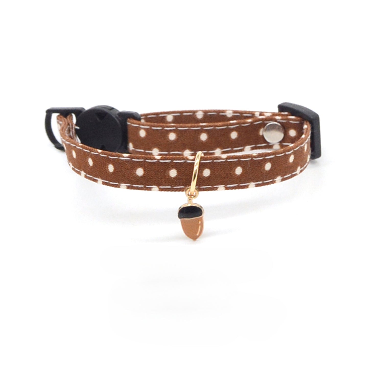 Cat wearing Mokka carrot charm breakaway collar with orange strap and silver charm