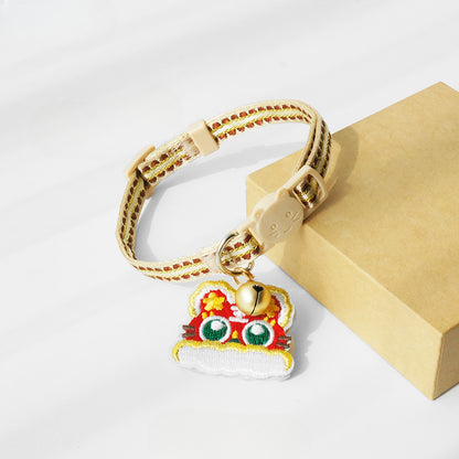 Mokka cat collar with tiger head charm displayed on a white background