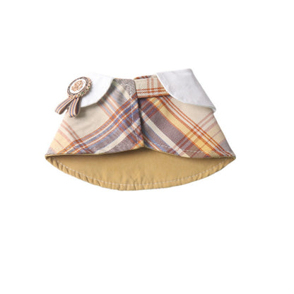 Mokka plaid rosette cape collar worn by a small dog