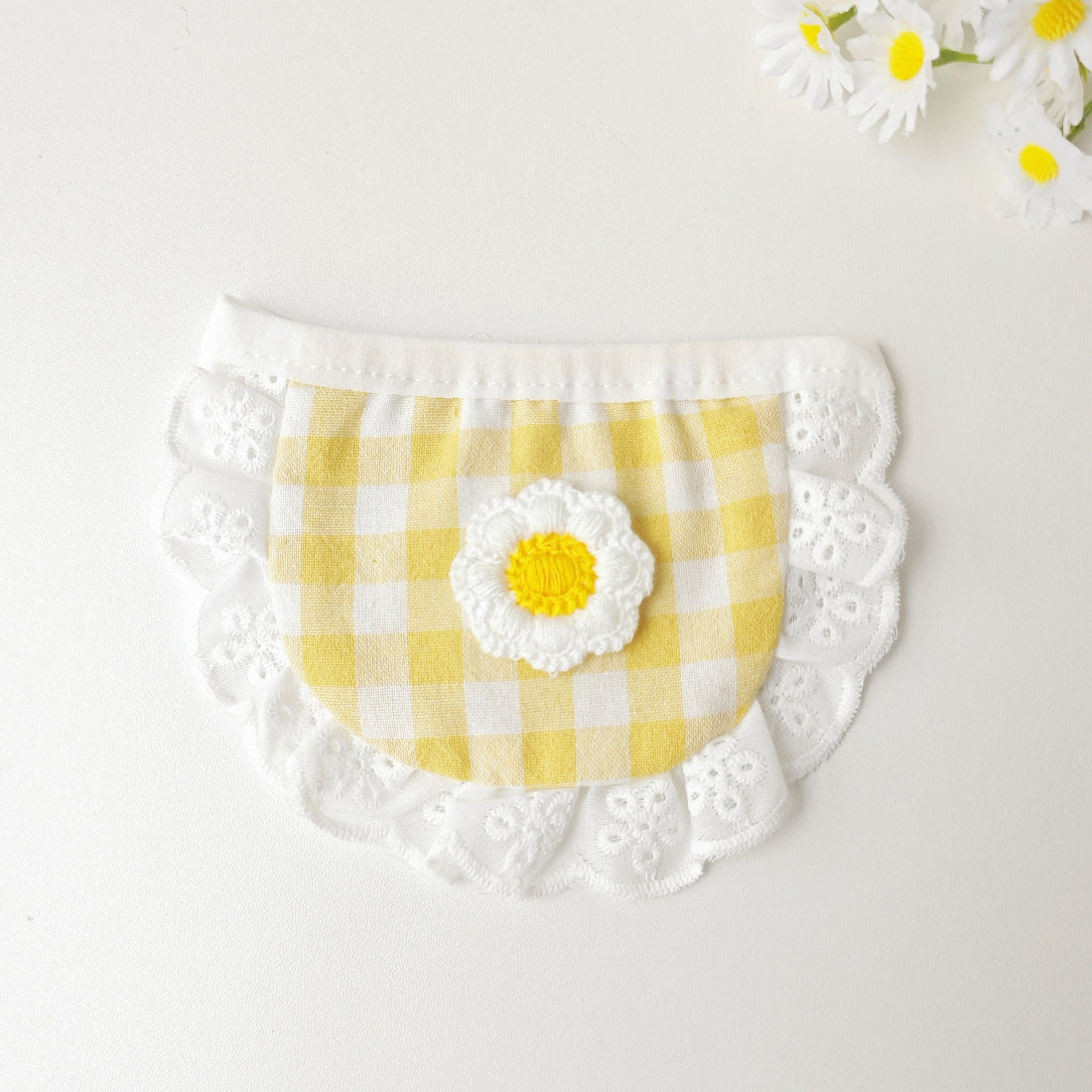 Side view of Mokka gingham daisy cat bib with adjustable strap