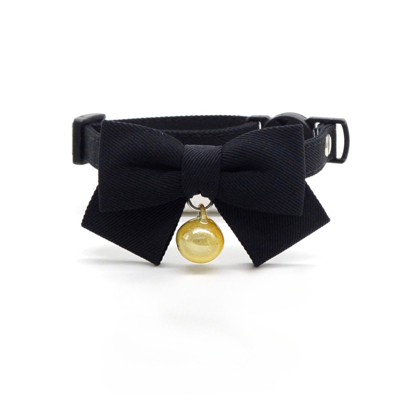 Cat wearing Mokka solid brown bow breakaway collar outdoors