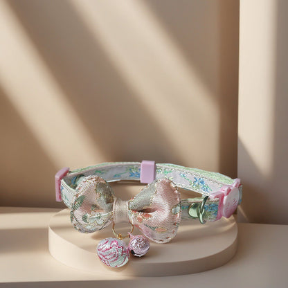 Side view of Mokka Bow Charm Cat Collar with bell attached