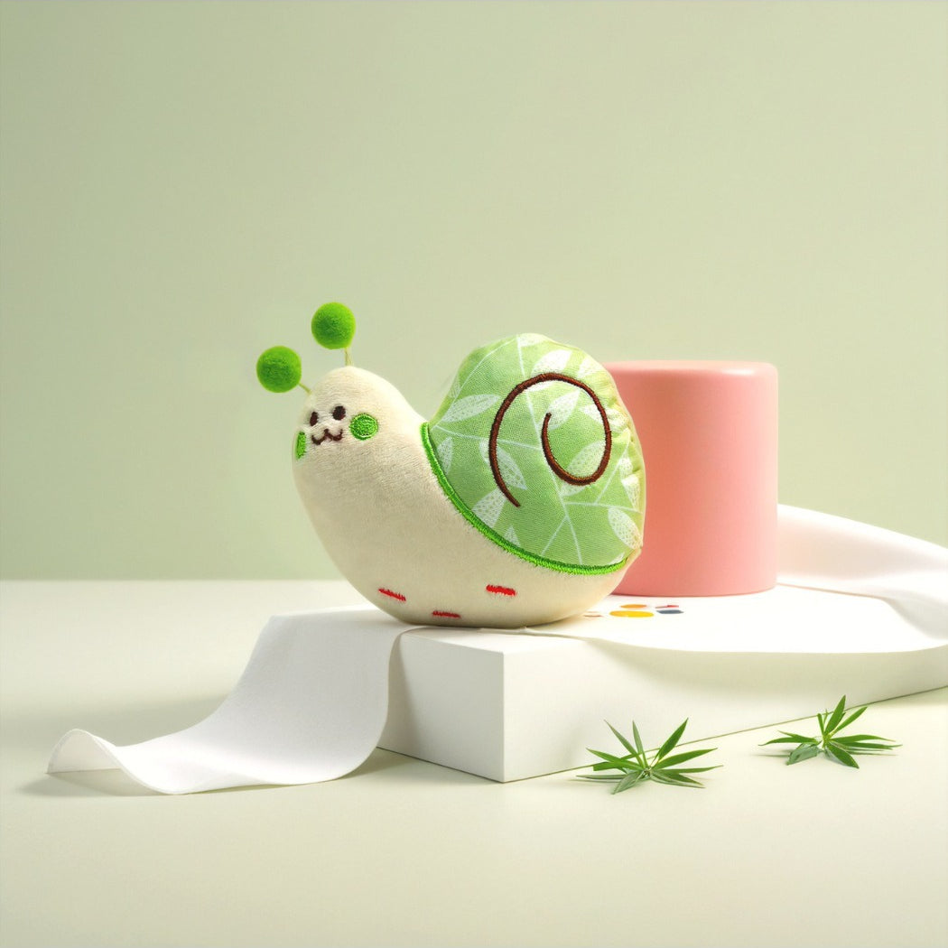 Side view of Petkin Leaf Shell Snail plush toy highlighting snail body and leaf shell