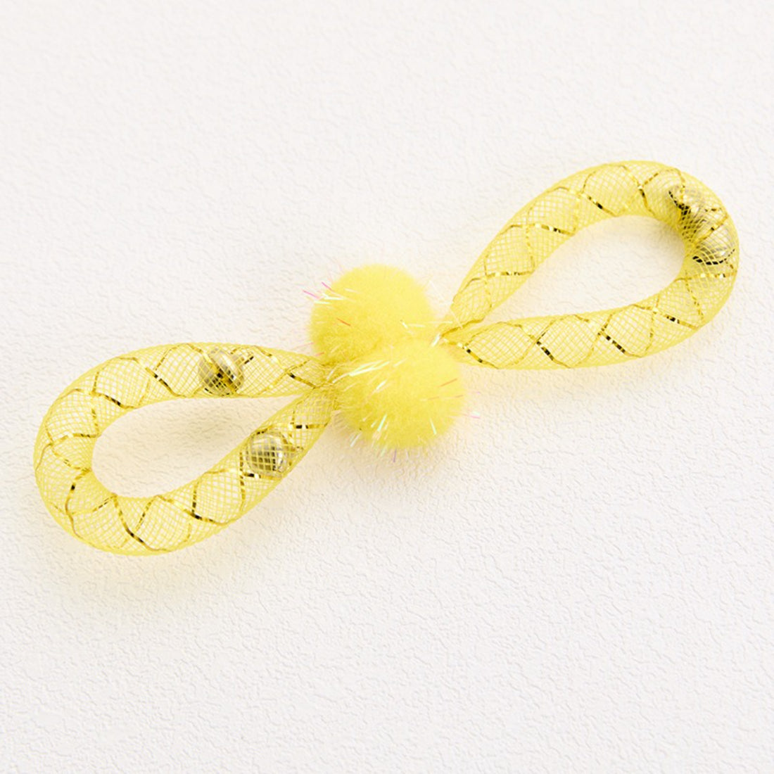 Moo cat toy with colorful pom-pom and white mesh body isolated on a white background