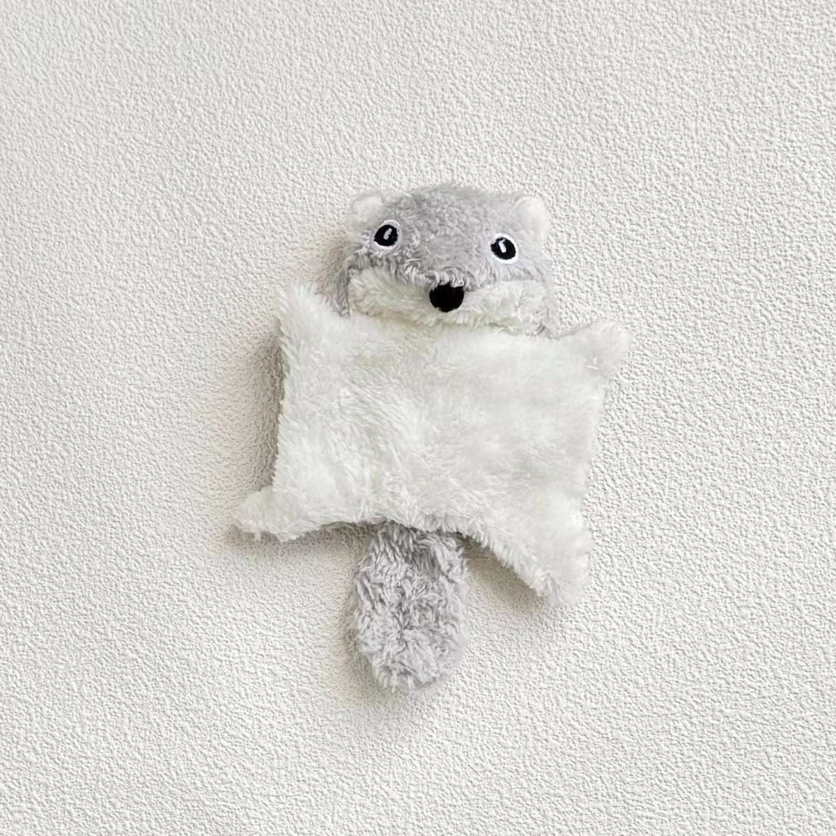Plush squirrel kicker cat toy positioned upright on a plain background