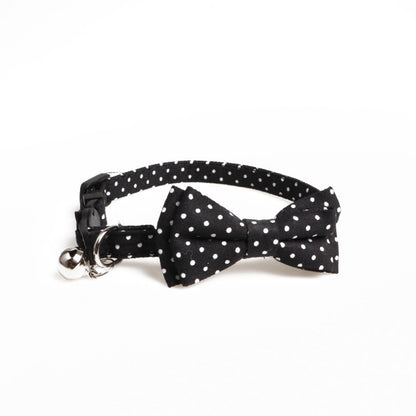 Mokka cat collar with red polka dot bow tie displayed flat showing adjustable strap