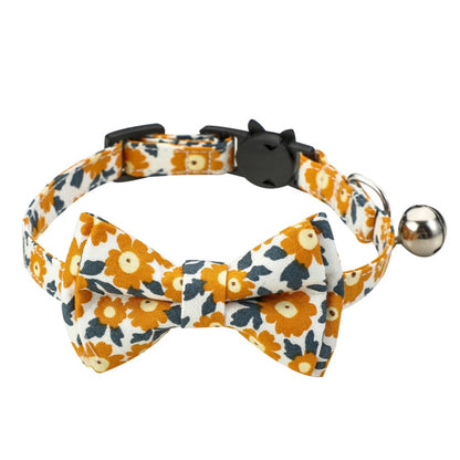 Mokka floral bowtie cat collar worn by a cat with visible floral pattern