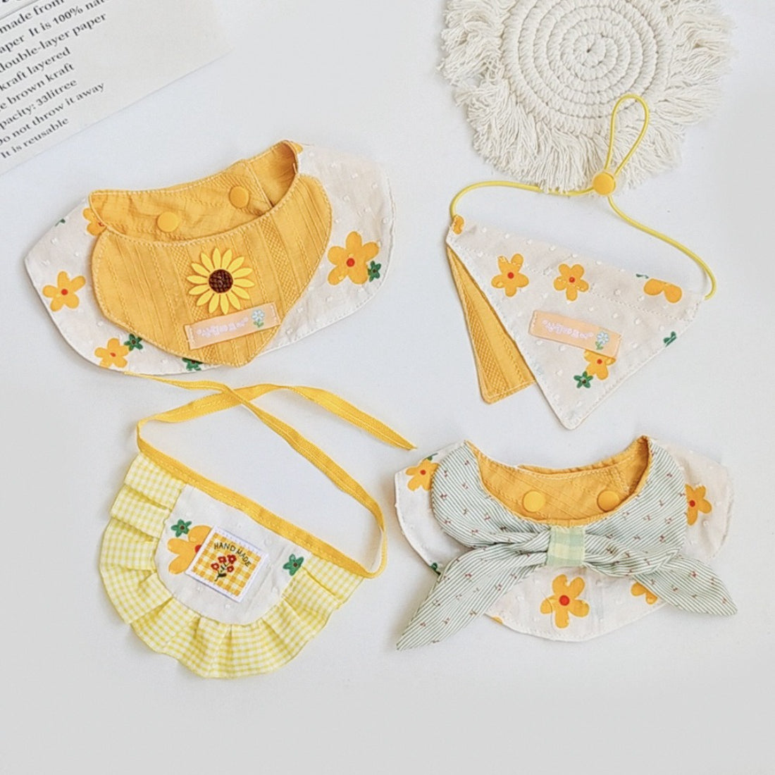 Mokka gingham sunflower cat bib displayed on a white background