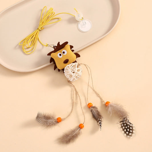 Close-up of plush lion head on hanging cat toy with detailed facial features