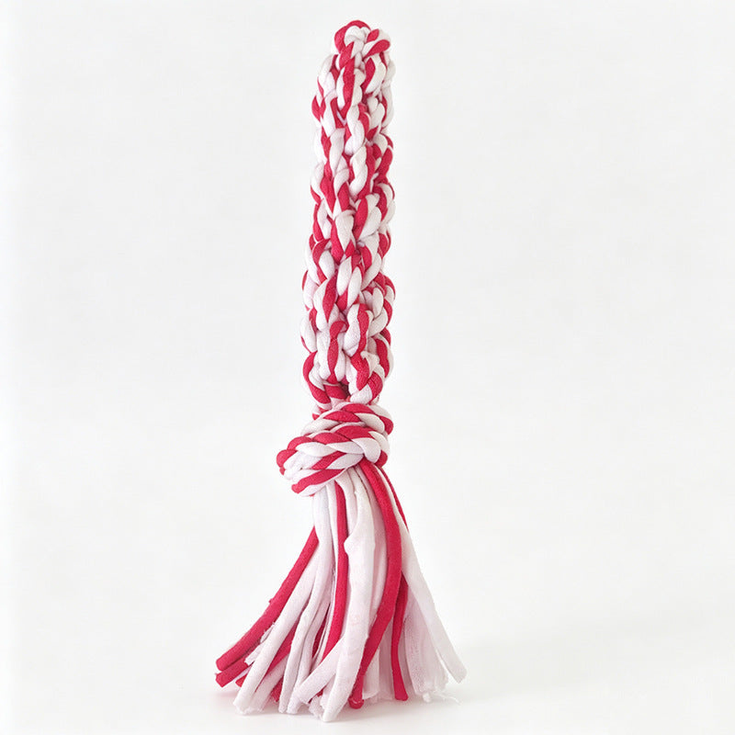 Red and white braided rope dog toy with a knotted section and loose tails
