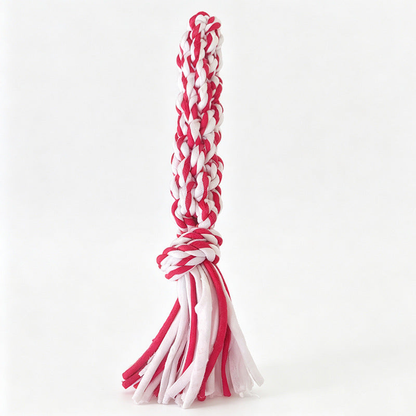 Red and white braided rope dog toy with a knotted section and loose tails