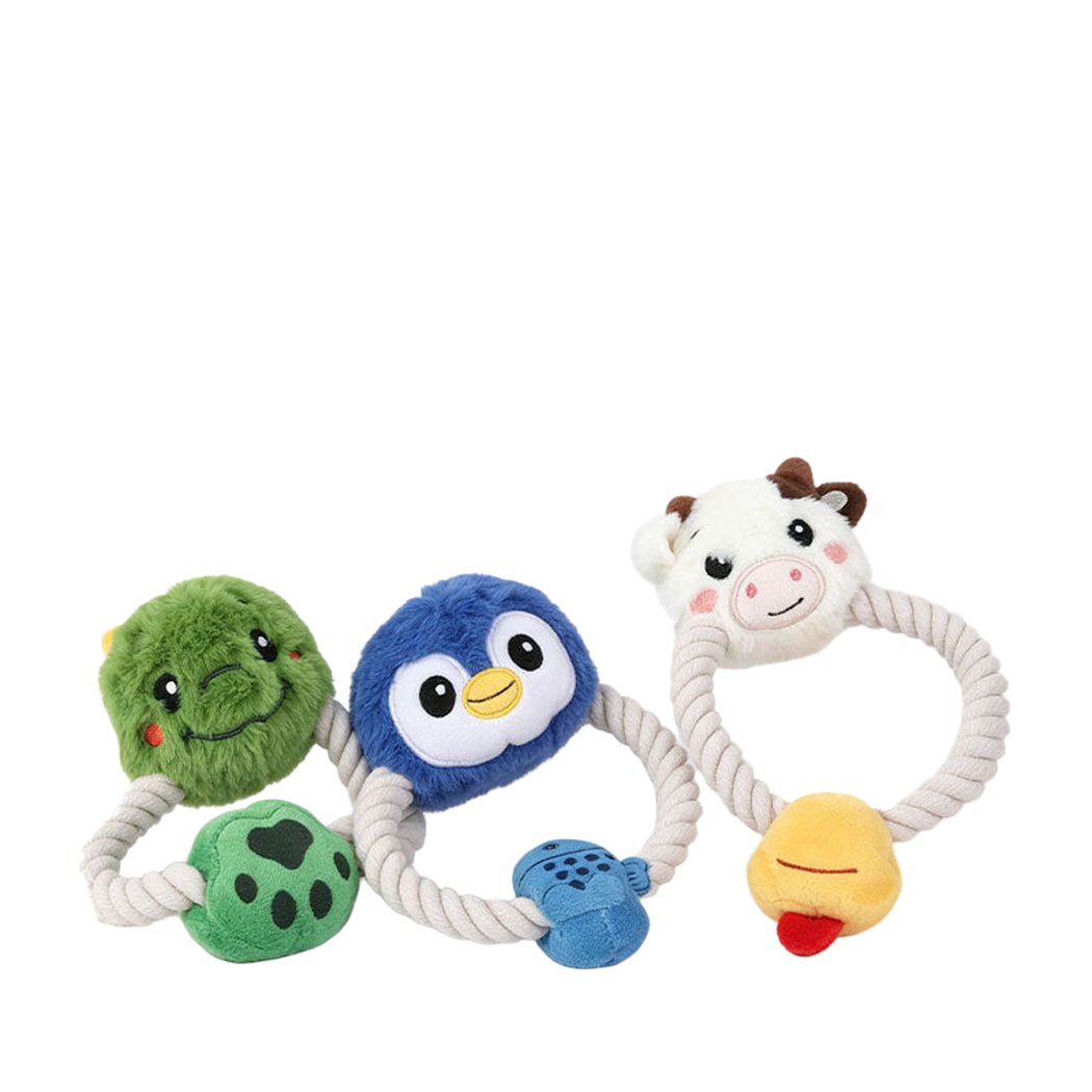Dinosaur, penguin, and cow plush rope dog toys arranged together
