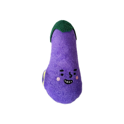 Purple eggplant-shaped plush dog toy with embroidered face, front view