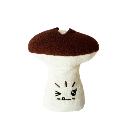 Mushroom-shaped plush dog toy with embroidered face, front view