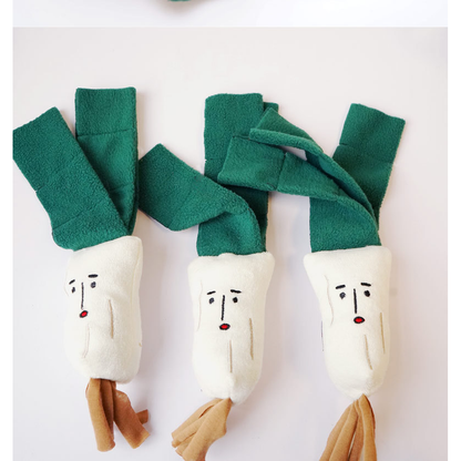 Three scallion-shaped plush dog toys displayed side by side