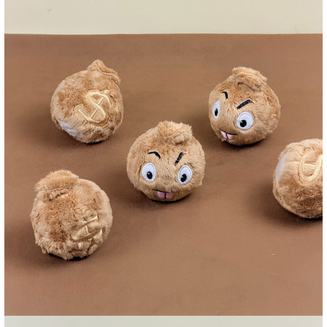 Brown money bag-shaped dog toys arranged upright to show face and dollar sign designs