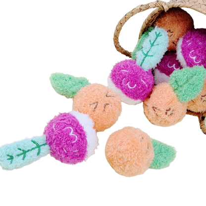 Carrot- and radish-shaped fuzzy dog toys displayed beside a woven basket