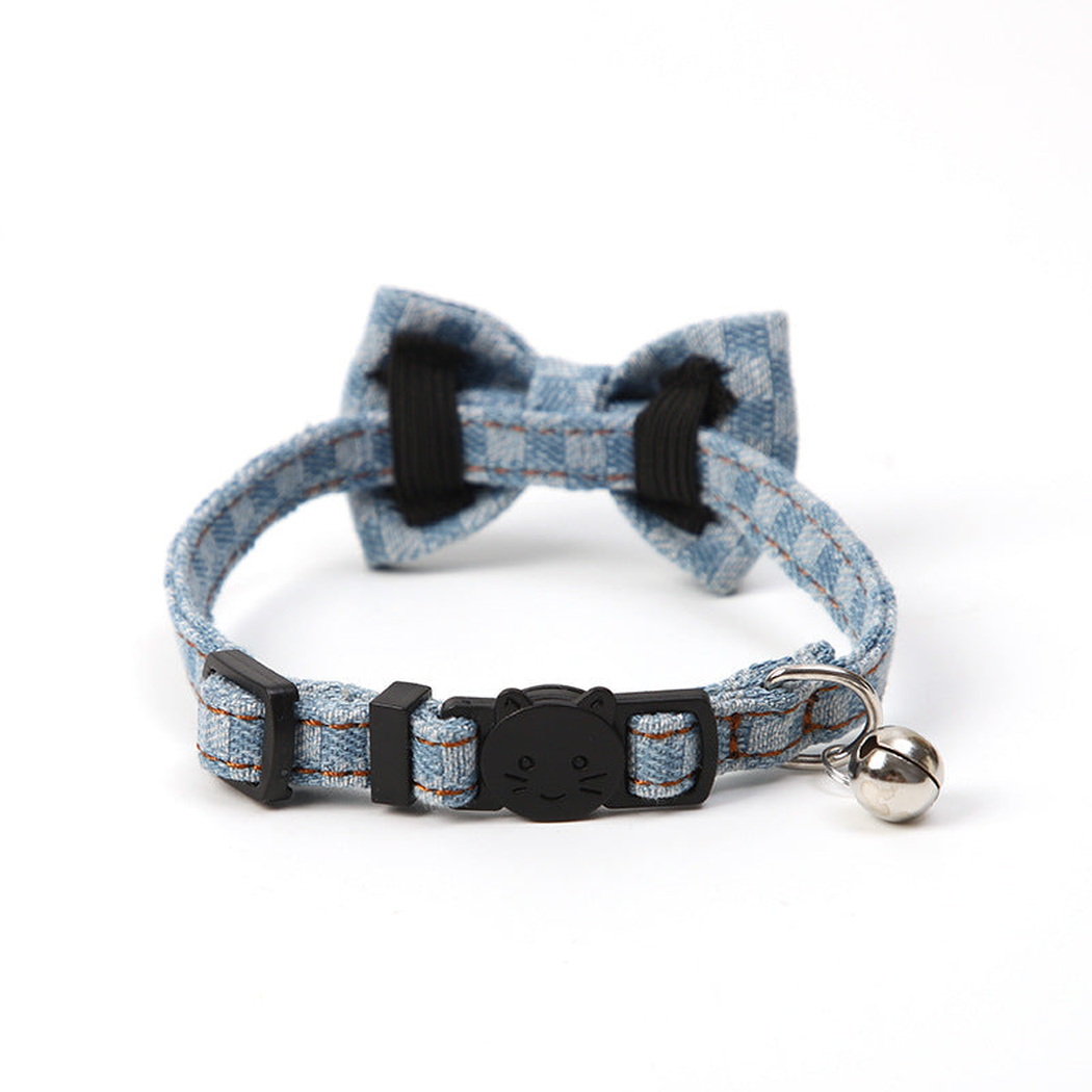 Light blue plaid bow pet collar showing the cat-face buckle, D-ring and bell