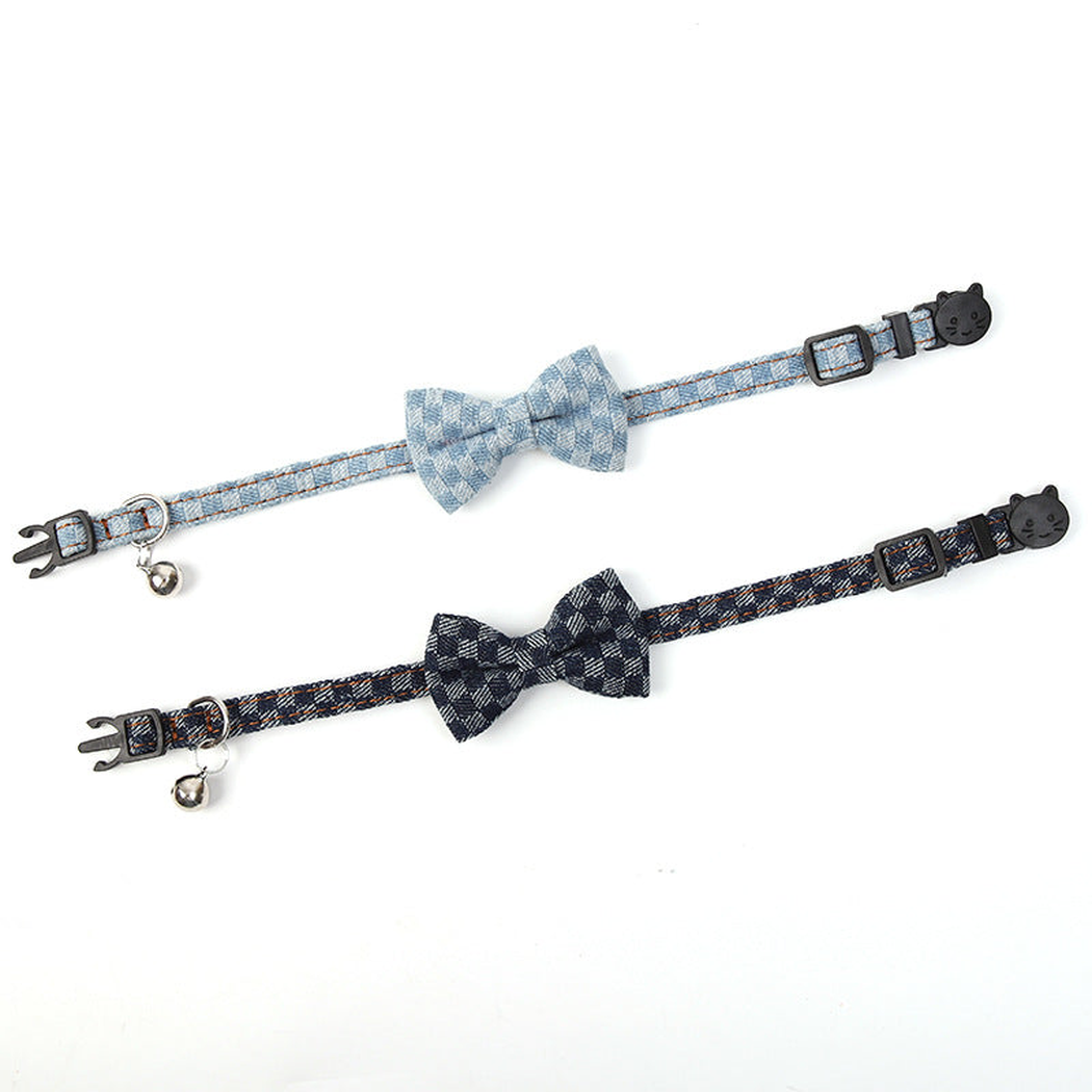 Navy and light blue plaid bow pet collars laid flat to show their full length