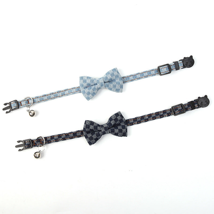 Navy and light blue plaid bow pet collars laid flat to show their full length