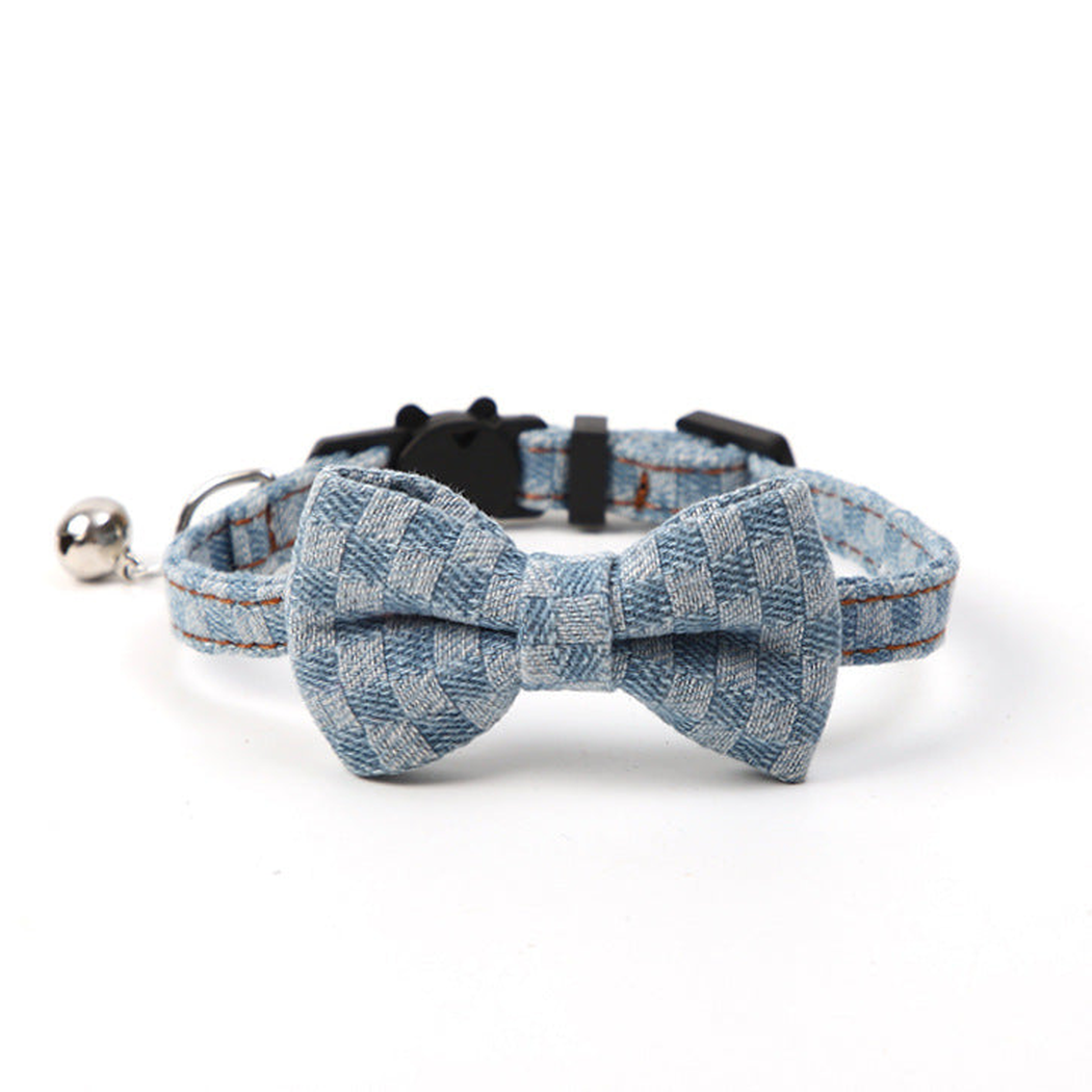 Light blue plaid pet collar with centered bow and bell, front view