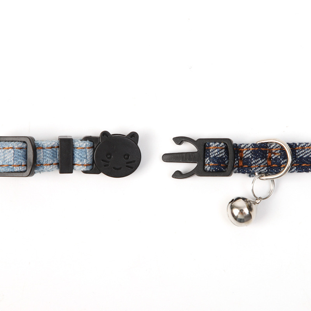 Close-up of the two-piece cat-face buckle closure and bell attachment