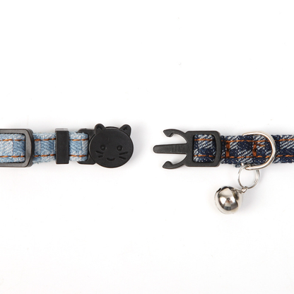 Close-up of the two-piece cat-face buckle closure and bell attachment