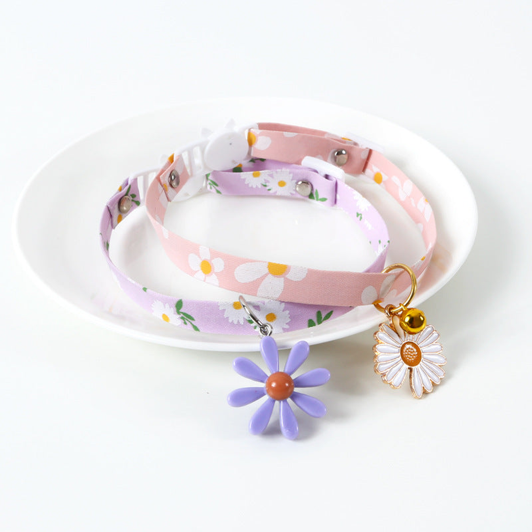 Pink and lavender daisy-print cat collars with flower charms
