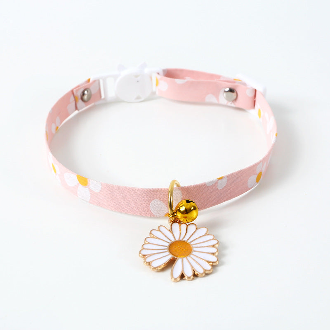 Pink daisy-print cat collar with white daisy charm and bell