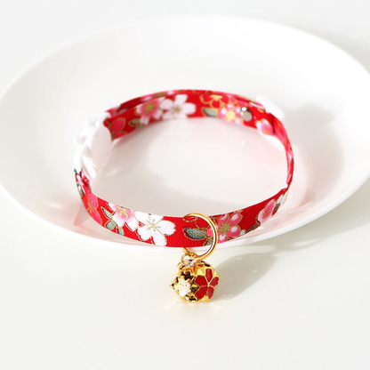Red floral cat collar with gold-tone floral bell