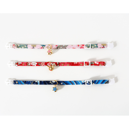 Three floral cat collars laid flat to show adjustable straps and buckles