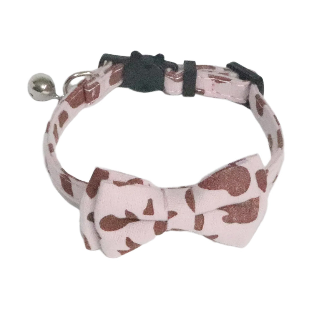 Light purple cow-print cat collar with bow tie and bell