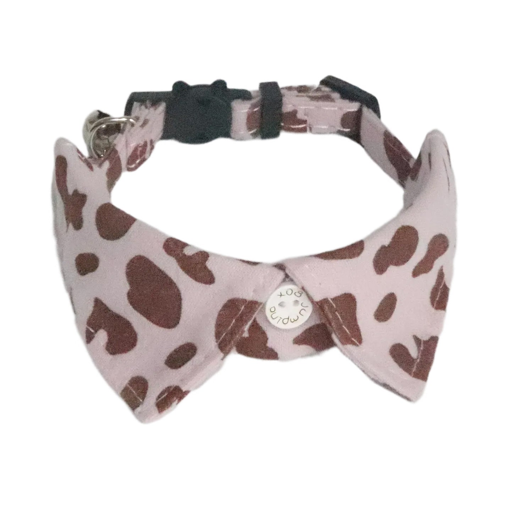 Light purple cow-print cat collar with pointed collar panels and bell