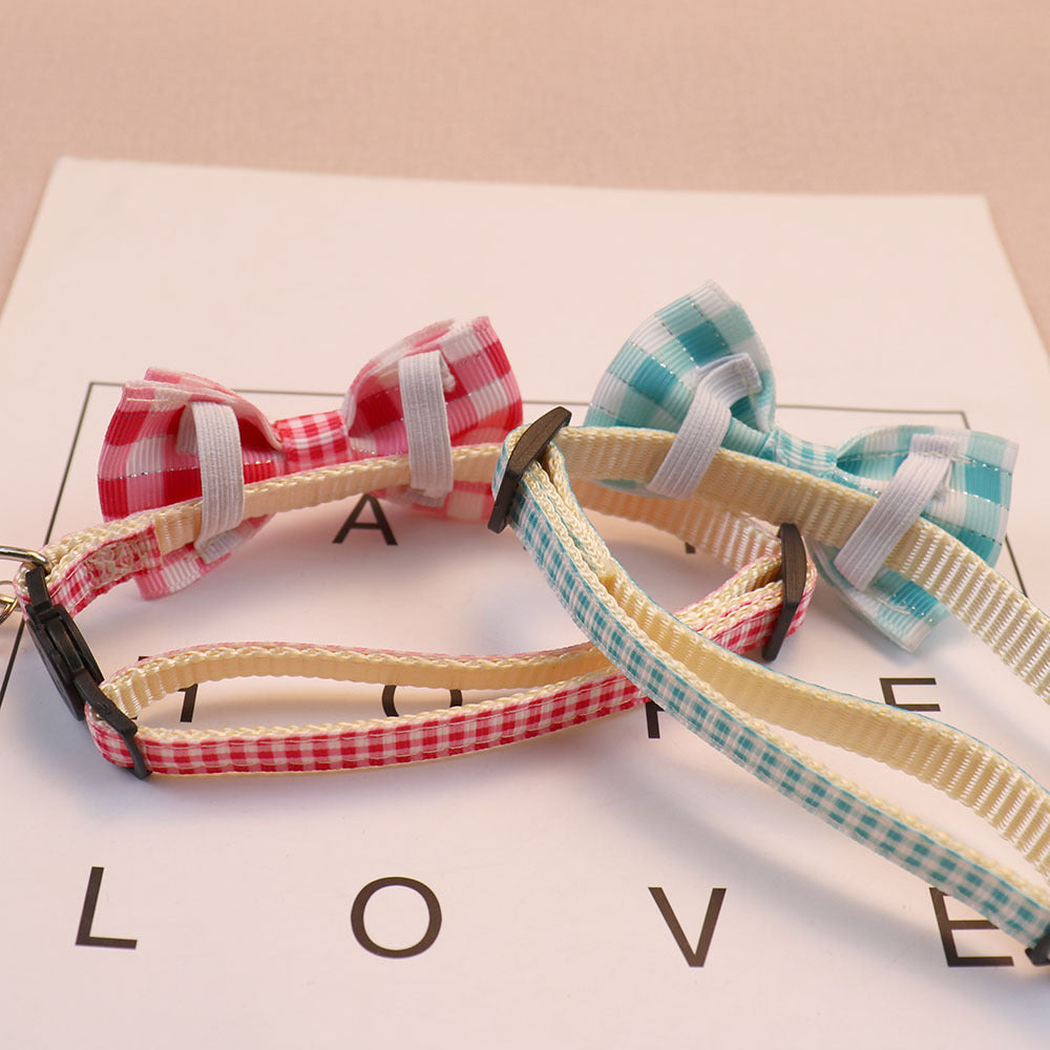 Back view of two gingham bow cat collars showing the bow loops and adjustable straps