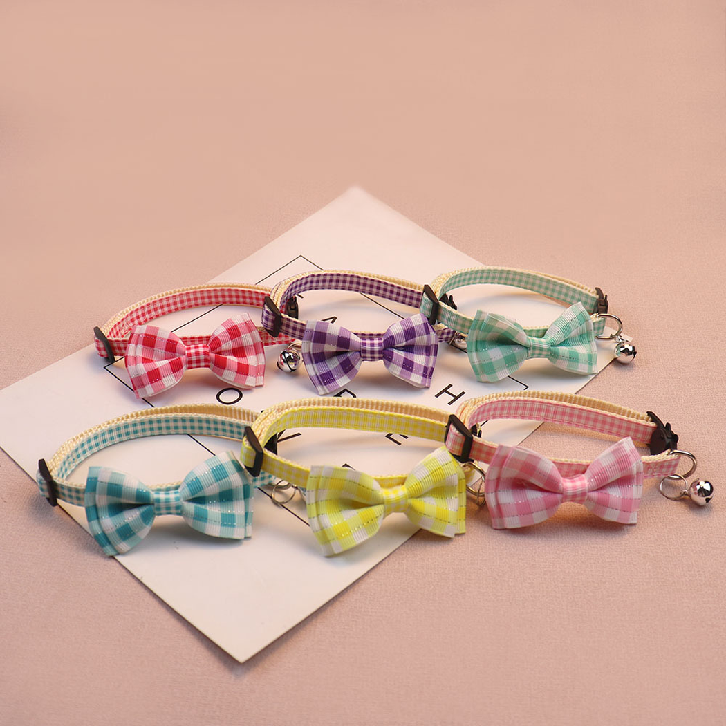 Six colorful gingham bow cat collars arranged in open loops