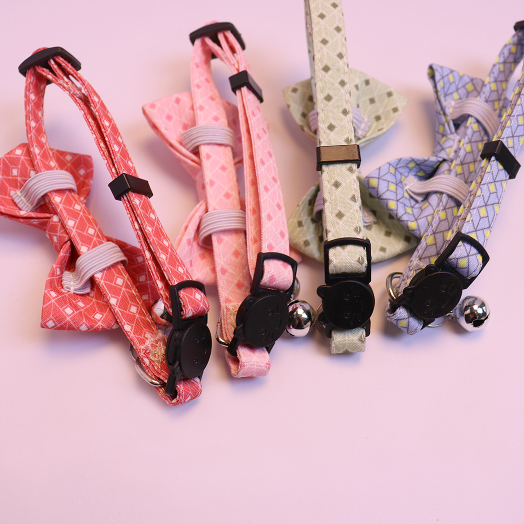Reverse detail of cat-face buckles and bow attachment loops on four cat collars