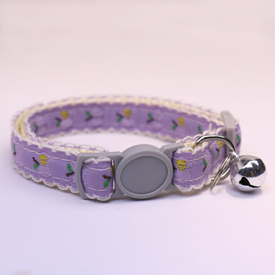 Purple patterned cat collar with gray buckle and bell
