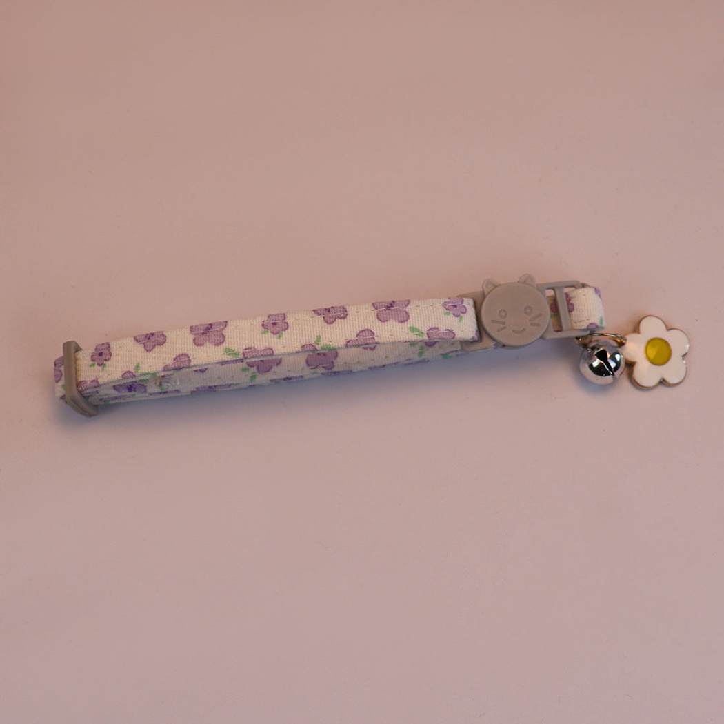 Purple floral cat collar with cat-face buckle, bell and flower charm