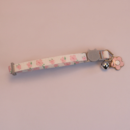 Pink floral cat collar with cat-face buckle, bell and pink flower charm