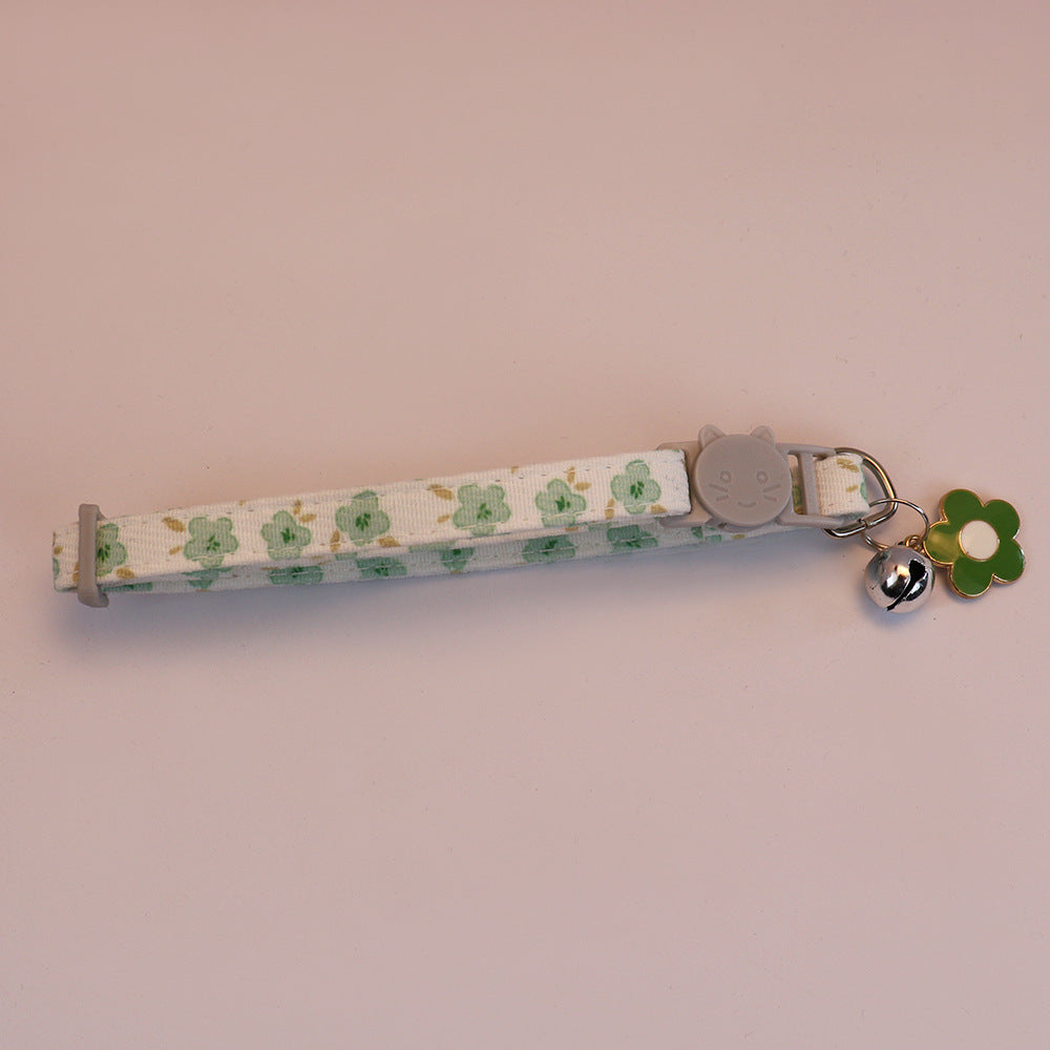 Green floral cat collar with cat-face buckle, bell and green flower charm